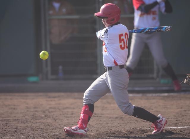 (261003) -- ANJO, Oct. 3, 2026 (Xinhua) -- He Xiaoyan of China hits the ball during the women's gold medal match of softball between China and Japan at the 20th Asian Games Aichi-Nagoya 2026 in Anjo of Aichi Prefecture, Japan, Oct. 3, 2026. (Xinhua/Luo Yuan)