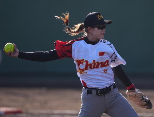 (261003) -- ANJO, Oct. 3, 2026 (Xinhua) -- Sun Yue of China throws the ball during the women's gold medal match of softball between China and Japan at the 20th Asian Games Aichi-Nagoya 2026 in Anjo of Aichi Prefecture, Japan, Oct. 3, 2026. (Xinhua/Luo Yuan)