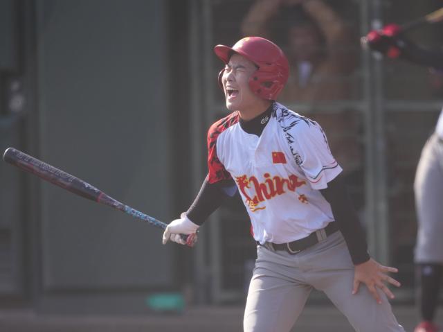 (261003) -- ANJO, Oct. 3, 2026 (Xinhua) -- Yan Siyu of China celebrates during the women's gold medal match of softball between China and Japan at the 20th Asian Games Aichi-Nagoya 2026 in Anjo of Aichi Prefecture, Japan, Oct. 3, 2026. (Xinhua/Luo Yuan)