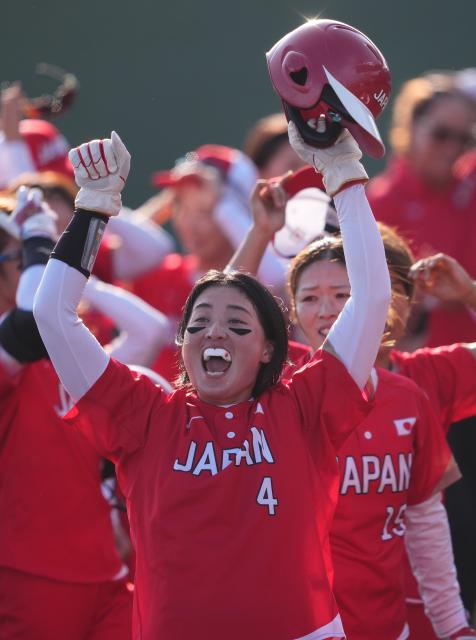 (261003) -- ANJO, Oct. 3, 2026 (Xinhua) -- Suto Shiho (front) of Japan celebrates winning the women's gold medal match of softball between China and Japan at the 20th Asian Games Aichi-Nagoya 2026 in Anjo of Aichi Prefecture, Japan, Oct. 3, 2026. (Xinhua/Luo Yuan)
