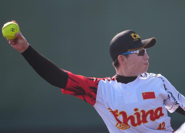 (261003) -- ANJO, Oct. 3, 2026 (Xinhua) -- Chai Yinan of China throws the ball during the women's gold medal match of softball between China and Japan at the 20th Asian Games Aichi-Nagoya 2026 in Anjo of Aichi Prefecture, Japan, Oct. 3, 2026. (Xinhua/Luo Yuan)
