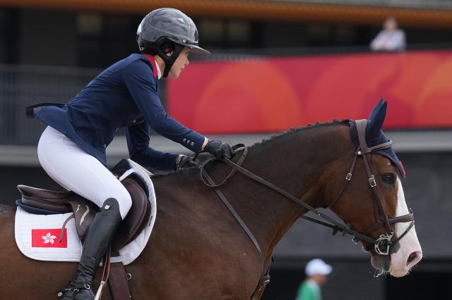 (261003) -- TOKYO, Oct. 3, 2026 (Xinhua) -- Lai Jacqueline Jing Man of China's Hong Kong competes during the jumping Ind A (1.45m-1.50m) 1st round of equestrian at the 20th Asian Games Aichi-Nagoya 2026 in Tokyo, Japan, Oct. 3, 2026. (Photo by Wang Shen/Xinhua)