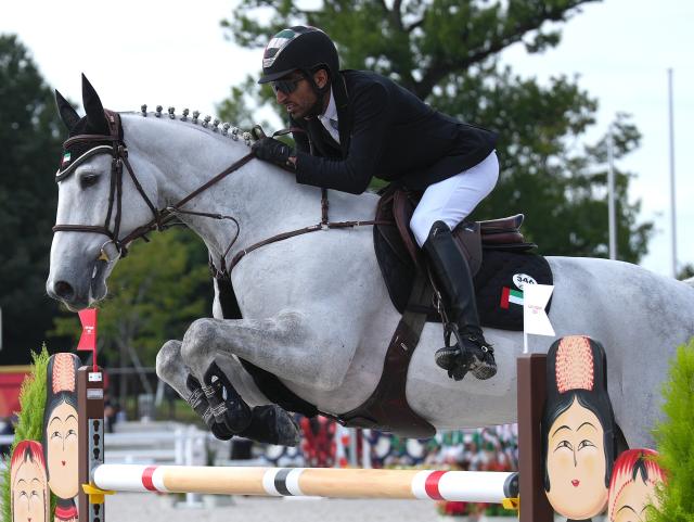 (261003) -- TOKYO, Oct. 3, 2026 (Xinhua) -- Humaid Almheiri of the United Arab Emirates competes during the jumping Ind A (1.45m-1.50m) 1st round of equestrian at the 20th Asian Games Aichi-Nagoya 2026 in Tokyo, Japan, Oct. 3, 2026. (Photo by Wang Shen/Xinhua)