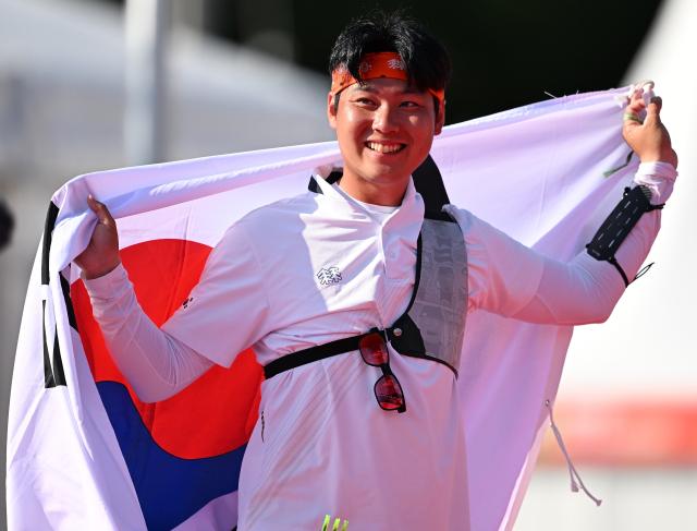 (261003) -- OKAZAKI, Oct. 3, 2026 (Xinhua) -- Lee Wooseok of South Korea celebrates winning the Recurve Men's Individual Gold Medal Match of Archery against Nakanishi Junya of Japan at the 20th Asian Games Aichi-Nagoya 2026 in Okazaki of Aichi Prefecture, Japan, Oct. 3, 2026. (Xinhua/Yu Yang)