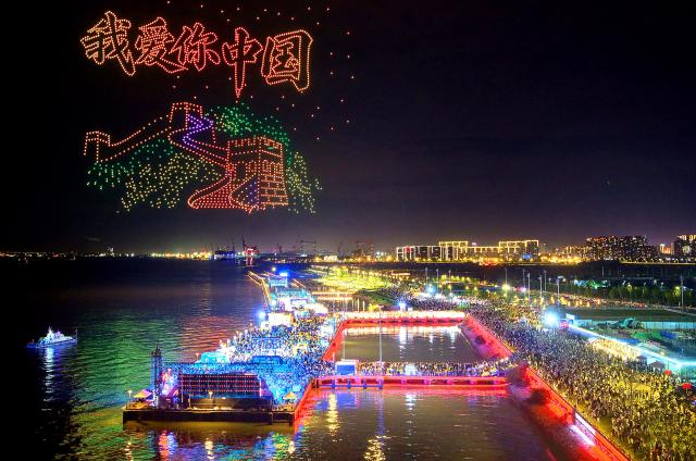 (261003) -- BEIJING, Oct. 3, 2026 (Xinhua) -- A drone photo shows people watching a drone light show in Nantong, east China's Jiangsu Province, Oct. 2, 2026.
  China's cultural and tourism market is thriving during this year's National Day holiday, with a wide range of options including scenic getaways, autumn outings, tourism with revolutionary topics, nighttime entertainment, and cultural tours featuring the country's intangible cultural heritage. (Photo by Xu Congjun/Xinhua)