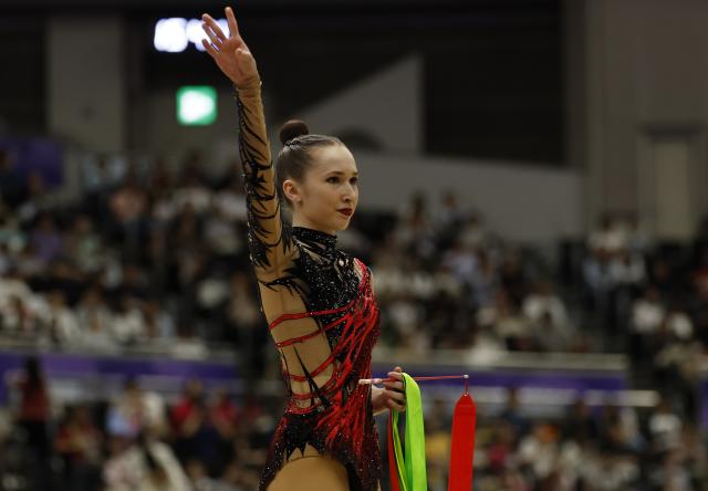 (261003) -- NAGOYA, Oct. 3, 2026 (Xinhua) -- Takhmina Ikromova of Uzbekistan greets the spectators during the Individual All-Around Final of Rhythmic Gymnastics at 20th Asian Games Aichi-Nagoya 2026 in Nagoya, Japan, Oct. 3, 2026. (Xinhua/Wu Zhizun)