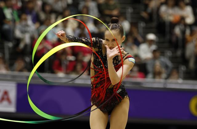 (261003) -- NAGOYA, Oct. 3, 2026 (Xinhua) -- Takhmina Ikromova of Uzbekistan competes during the Individual All-Around Final of Rhythmic Gymnastics at 20th Asian Games Aichi-Nagoya 2026 in Nagoya, Japan, Oct. 3, 2026. (Xinhua/Wu Zhizun)