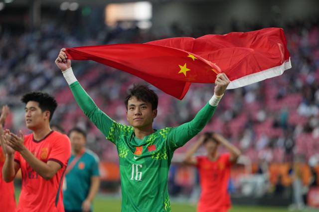(261003) -- TOYOTA, Oct. 3, 2026 (Xinhua) -- Li Hao, goalkeeper of China celebrates after winning the men's 3rd place match of football between China and Uzbekistan at 20th Asian Games Aichi-Nagoya 2026 in Toyota of Aichi Prefecture, Japan, Oct. 3, 2026. (Xinhua/Lui Siu Wai)
