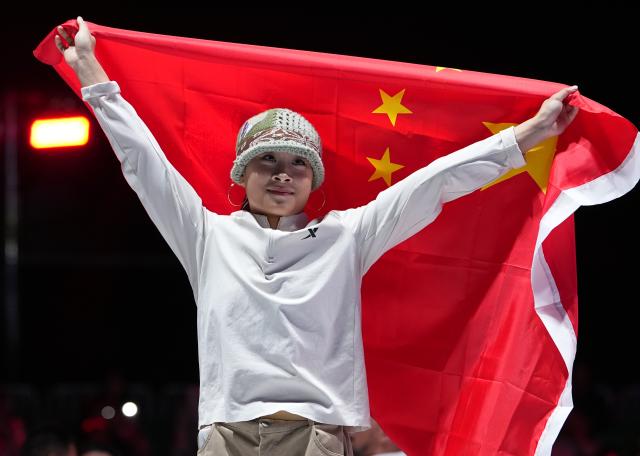 (261003) -- TOKONAME, Oct. 3, 2026 (Xinhua) -- Guo Pu of China greets the spectators after the B-Girls final match of Breaking against Fukushima Ayumi of Japan at the 20th Asian Games Aichi-Nagoya 2026 in Tokoname of Aichi Prefecture, Japan, Oct. 3, 2026. (Xinhua/Cheong Kam Ka)