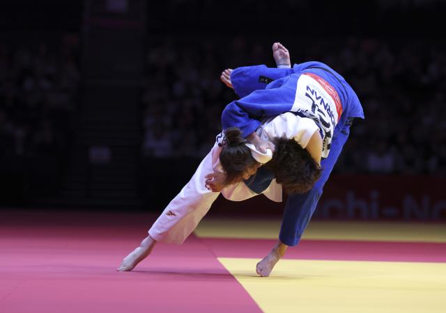 (261003) -- NAGOYA, Oct. 3, 2026 (Xinhua) -- Zhang Wen (L) of team China competes against Anujin Uran-Ulzii of team Mongolia during the mixed team matches for bronze medals of Judo between China and Mongolia at the 20th Asian Games Aichi-Nagoya 2026 in Nagoya, Japan, Oct. 3, 2026. (Xinhua/Yao Qilin)