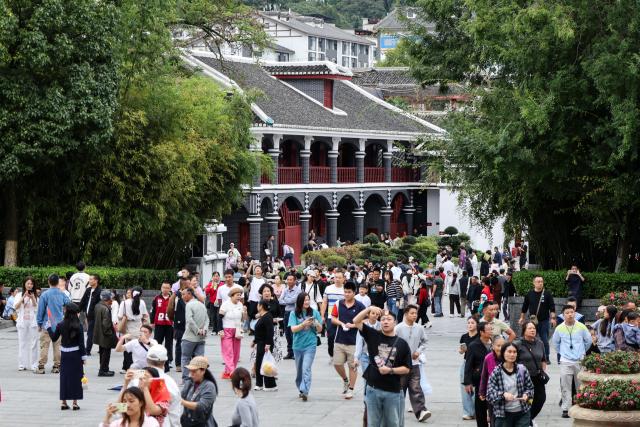 (261003) -- ZUNYI, Oct. 3, 2026 (Xinhua) -- Tourists visit the historical site of the Zunyi Meeting in Zunyi City, southwest China's Guizhou Province, Oct. 2, 2026.
  The renovation of the Zunyi Meeting historical site and the upgrading of the Zunyi Meeting memorial hall were completed ahead of the country's National Day holiday that started from Oct. 1, drawing a surge of visitors in recent days.  
   Known as China's "city of historic turning point," Zunyi holds a special place in the nation's history. In January 1935, during the Long March, the Communist Party of China (CPC) convened the Zunyi Meeting in a two-story building here at a critical historical crossroads. The meeting is regarded as a milestone in the history of the CPC, marking the formation of its first generation of central collective leadership.
   Today, Zunyi is one of China's best-known destinations for historical education tours, which take visitors to sites associated with the country's revolutionary history. (Photo by Luo Xinghan/Xinhua)