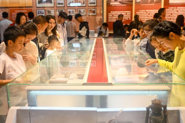 (261003) -- ZUNYI, Oct. 3, 2026 (Xinhua) -- Tourists visit the Zunyi Meeting memorial hall in Zunyi City, southwest China's Guizhou Province, Oct. 1, 2026.
  The renovation of the Zunyi Meeting historical site and the upgrading of the Zunyi Meeting memorial hall were completed ahead of the country's National Day holiday that started from Oct. 1, drawing a surge of visitors in recent days.  
   Known as China's "city of historic turning point," Zunyi holds a special place in the nation's history. In January 1935, during the Long March, the Communist Party of China (CPC) convened the Zunyi Meeting in a two-story building here at a critical historical crossroads. The meeting is regarded as a milestone in the history of the CPC, marking the formation of its first generation of central collective leadership.
   Today, Zunyi is one of China's best-known destinations for historical education tours, which take visitors to sites associated with the country's revolutionary history. (Photo by Yuan Fuhong/Xinhua)