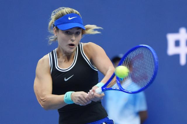(261003) -- BEIJING, Oct. 3, 2026 (Xinhua) -- Anna Kalinskaya of Russia hits a return to Zheng Qinwen of China during the women's singles second round match at 2026 China Open tennis tournament in Beijing, China, Oct. 3, 2026. (Xinhua/Xie Han)