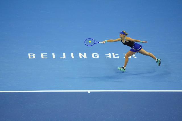 (261003) -- BEIJING, Oct. 3, 2026 (Xinhua) -- Anna Kalinskaya of Russia hits a return to Zheng Qinwen of China during the women's singles second round match at 2026 China Open tennis tournament in Beijing, China, Oct. 3, 2026. (Xinhua/Xie Han)