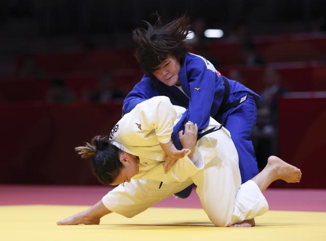 (261003) -- NAGOYA, Oct. 3, 2026 (Xinhua) -- Terada Utana (top) of team Japan competes with Azhar Askhat of team Kazakhstan during the mixed team final of judo between Japan and Kazakhstan at the 20th Asian Games Aichi-Nagoya 2026 in Nagoya, Japan, Oct. 3, 2026. (Xinhua/Yao Qilin)