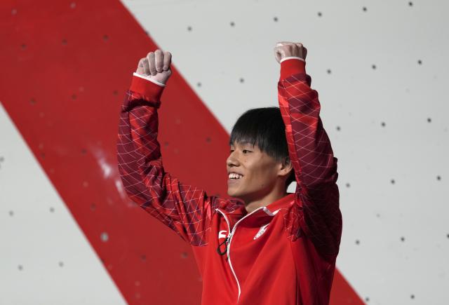 (261003) -- NAGOYA, Oct. 3, 2026 (Xinhua) -- Suzuku Neo of Japan celebrates after winning the men's lead final of sport climbing at 20th Asian Games Aichi-Nagoya 2026 in Nagoya, Japan, Oct. 3, 2026. (Xinhua/Zhou Mi)