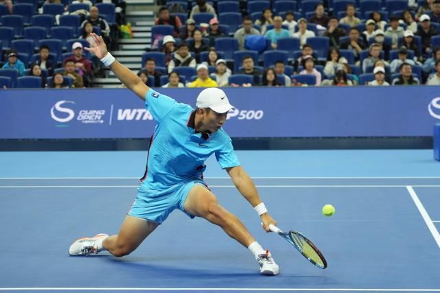 (261003) -- BEIJING, Oct. 3, 2026 (Xinhua) -- Shang Juncheng of China hits a return to Alexander Zverev of Germany during the men's singles second round match at 2026 China Open tennis tournament in Beijing, China, Oct. 3, 2026. (Xinhua/Xie Han)
