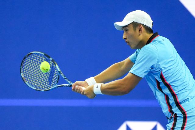 (261003) -- BEIJING, Oct. 3, 2026 (Xinhua) -- Shang Juncheng of China hits a return to Alexander Zverev of Germany during the men's singles second round match at 2026 China Open tennis tournament in Beijing, China, Oct. 3, 2026. (Xinhua/Xie Han)