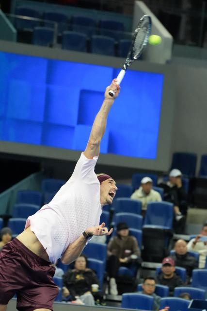 (261003) -- BEIJING, Oct. 3, 2026 (Xinhua) -- Alexander Zverev of Germany serves to Shang Juncheng of China during the men's singles second round match at 2026 China Open tennis tournament in Beijing, China, Oct. 3, 2026. (Xinhua/Xie Han)