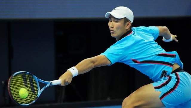 (261003) -- BEIJING, Oct. 3, 2026 (Xinhua) -- Shang Juncheng of China hits a return to Alexander Zverev of Germany during the men's singles second round match at 2026 China Open tennis tournament in Beijing, China, Oct. 3, 2026. (Xinhua/Xie Han)
