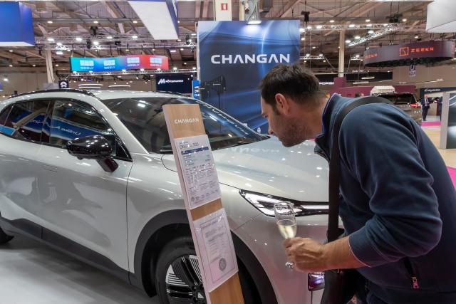(261003) -- ATHENS, Oct. 3, 2026 (Xinhua) -- A visitor looks at Changan electric vehicle during the media preview of the AUTO ATHINA 2026 in Athens, Greece, Oct. 2, 2026. TO GO WITH "Roundup: Growing presence of Chinese brands in Greek market highlighted at AUTO ATHINA 2026" (Photo by Marios Lolos/Xinhua)
