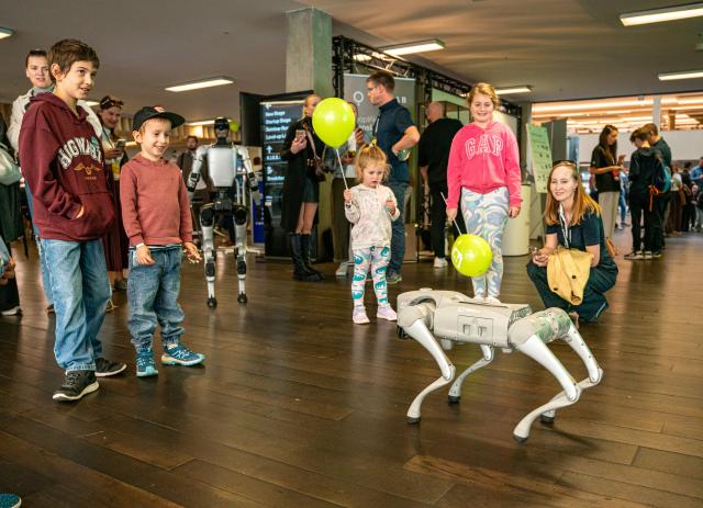 (261003) -- PRAGUE, Oct. 3, 2026 (Xinhua) -- Children watch a robotic dog at the Prague Innovation Week in Prague, the Czech Republic, Oct. 3, 2026. Prague Innovation Week was held in the Czech capital Prague from October 1 to 3. (Photo by Dana Kesnerova/Xinhua)