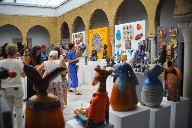(261004) -- TUNIS, Oct. 4, 2026 (Xinhua) -- People view ceramic artworks during an exhibition at the National Center for Artistic Ceramics in Tunis, Tunisia, on Oct. 3, 2026. The National Center for Artistic Ceramics has displayed over 1,500 ceramic pieces created by the center's students from Saturday to Sunday. (Photo by Adel Ezzine/Xinhua)