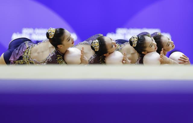 (261004) -- BEIJING, Oct. 4, 2026 (Xinhua) -- Players of team China compete during the Group All-Around of Rhythmic Gymnastics at 20th Asian Games Aichi-Nagoya 2026 in Nagoya, Japan, Oct. 3, 2026. (Xinhua/Wu Zhizun)
