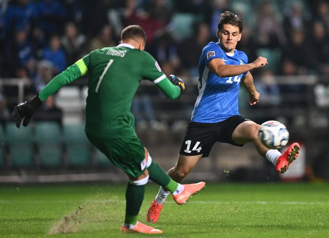 (261004) -- TALLINN, Oct. 4, 2026 (Xinhua) -- Estonia's Patrik Kristal (R) challenges Luxembourg's goalkeeper Anthony Moris during the 2026/27 UEFA Nations League C Group C4 football match between Estonia and Luxembourg at A. Le Coq Arena in Tallinn, Estonia, Oct. 3, 2026. (Photo by Sergei Stepanov/Xinhua)