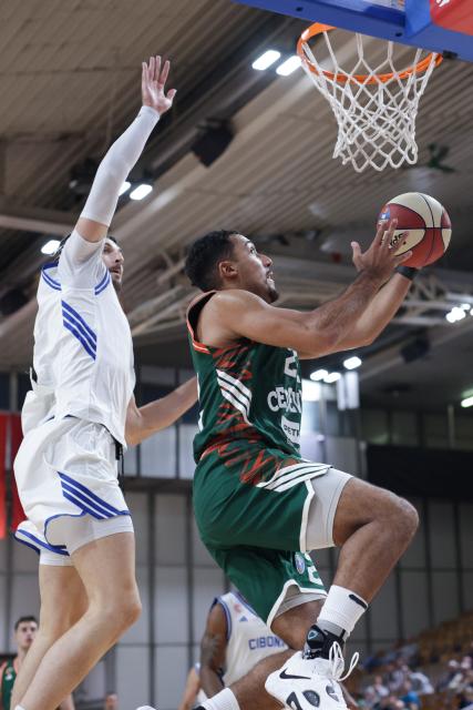 (261004) -- LJUBLJANA, Oct. 4, 2026 (Xinhua) -- Noah Arthur Kirkwood (R) of Cedevita Olimpija goes up to the basket during the ABA Basketball League Season 2026/27-Group A ROUND 2 match between Cedevita Olimpija and Cibona at Mala dvorana Tivoli in Ljubljana, Slovenia, Oct. 3, 2026. (Photo by Zeljko Stevanic/Xinhua)