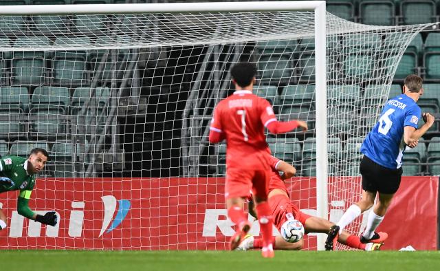 (261004) -- TALLINN, Oct. 4, 2026 (Xinhua) -- Estonia's Rasmus Peetson (R) scores the opening goal during the 2026/27 UEFA Nations League C Group C4 football match between Estonia and Luxembourg at A. Le Coq Arena in Tallinn, Estonia, Oct. 3, 2026. (Photo by Sergei Stepanov/Xinhua)