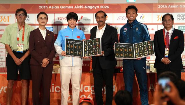 (261004) -- NAGOYA, Oct. 4, 2026 (Xinhua) -- Chinese swimmer Yu Zidi (3rd L) and Thai sprinter Puripol Boonson (2nd R), the most valuable player (MVP) of the 20th Asian Games, pose with Ding Ning (2nd L), chair of the Athletes' Committee of the Olympic Council of Asia (OCA), Mohammad Tayyab Ikram (3rd R), chairman of the Aichi-Nagoya 2026 Asian Games Coordination Committee, and Vinod Kumar Tiwari (1st R), deputy director general of the OCA, during the awarding ceremony at the 20th Asian Games Aichi-Nagoya 2026 in Nagoya, Japan, Oct. 4, 2026. (Xinhua/Hou Zhaokang)