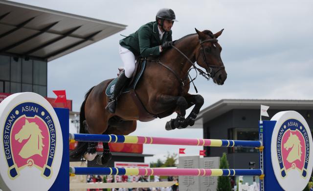(261004) -- TOKYO, Oct. 4, 2026 (Xinhua) -- Abdulrahman Bader M Alrajhi of Saudi Arabia riding Lorenzo ES competes during the jumping Ind B (up to 1.55m) 2nd round of equestrian at the 20th Asian Games Aichi-Nagoya 2026 in Tokyo, Japan, Oct. 4, 2026. (Photo by Wang Shen/Xinhua)
