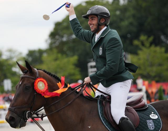 (261004) -- TOKYO, Oct. 4, 2026 (Xinhua) -- Silver medalist Abdulrahman Bader M Alrajhi of Saudi Arabia riding Lorenzo ES celebrates after the victory ceremony for the jumping Ind B (up to 1.55m) event of equestrian at the 20th Asian Games Aichi-Nagoya 2026 in Tokyo, Japan, Oct. 4, 2026. (Photo by Wang Shen/Xinhua)