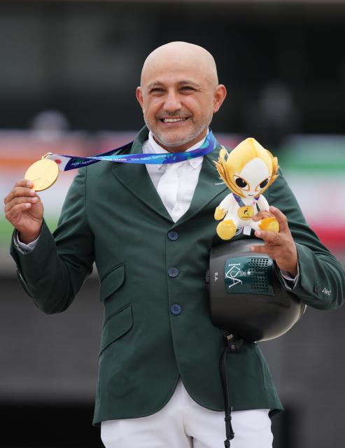 (261004) -- TOKYO, Oct. 4, 2026 (Xinhua) -- Gold medalist Ramzy Hamad Al Duhami of Saudi Arabia poses during the victory ceremony for the jumping Ind B (up to 1.55m) event of equestrian at the 20th Asian Games Aichi-Nagoya 2026 in Tokyo, Japan, Oct. 4, 2026. (Photo by Wang Shen/Xinhua)