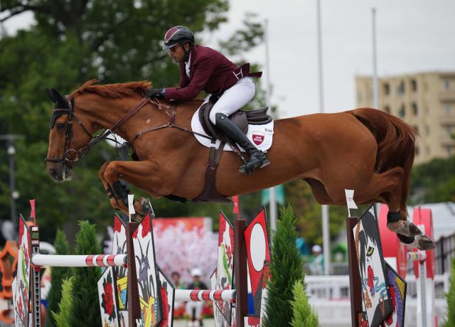 (261004) -- TOKYO, Oct. 4, 2026 (Xinhua) -- Basem Mohammed of Qatar riding Chaccball competes during the jumping Ind B (up to 1.55m) 2nd round of equestrian at the 20th Asian Games Aichi-Nagoya 2026 in Tokyo, Japan, Oct. 4, 2026. (Photo by Wang Shen/Xinhua)
