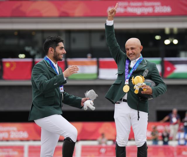 (261004) -- TOKYO, Oct. 4, 2026 (Xinhua) -- Gold medalist Ramzy Hamad Al Duhami (R) of Saudi Arabia and silver medalist Abdulrahman Bader M Alrajhi of Saudi Arabia celebrate during the victory ceremony for the jumping Ind B (up to 1.55m) event of equestrian at the 20th Asian Games Aichi-Nagoya 2026 in Tokyo, Japan, Oct. 4, 2026. (Photo by Wang Shen/Xinhua)