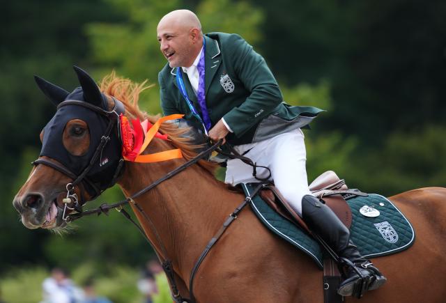(261004) -- TOKYO, Oct. 4, 2026 (Xinhua) -- Gold medalist Ramzy Hamad Al Duhami of Saudi Arabia riding Untouchable 32 celebrates after the victory ceremony for the jumping Ind B (up to 1.55m) event of equestrian at the 20th Asian Games Aichi-Nagoya 2026 in Tokyo, Japan, Oct. 4, 2026. (Photo by Wang Shen/Xinhua)