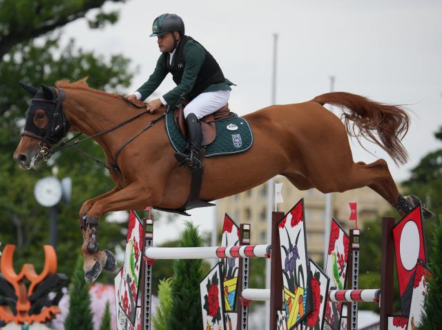 (261004) -- TOKYO, Oct. 4, 2026 (Xinhua) -- Ramzy Hamad Al Duhami of Saudi Arabia riding Untouchable 32 competes during the jumping Ind B (up to 1.55m) 2nd round of equestrian at the 20th Asian Games Aichi-Nagoya 2026 in Tokyo, Japan, Oct. 4, 2026. (Photo by Wang Shen/Xinhua)