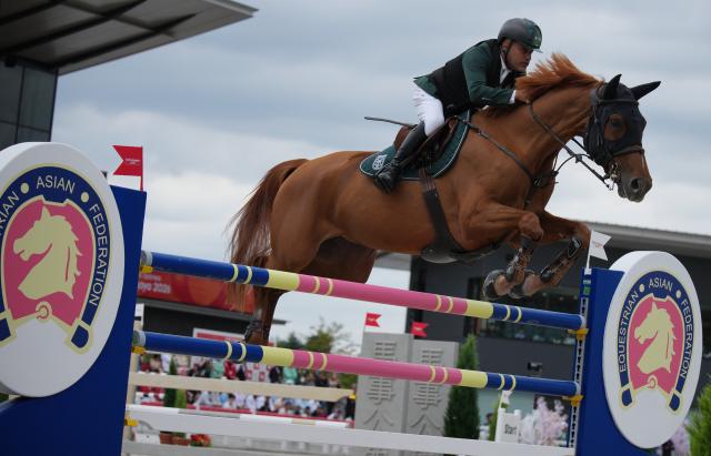(261004) -- TOKYO, Oct. 4, 2026 (Xinhua) -- Ramzy Hamad Al Duhami of Saudi Arabia riding Untouchable 32 competes during the jumping Ind B (up to 1.55m) 2nd round of equestrian at the 20th Asian Games Aichi-Nagoya 2026 in Tokyo, Japan, Oct. 4, 2026. (Photo by Wang Shen/Xinhua)