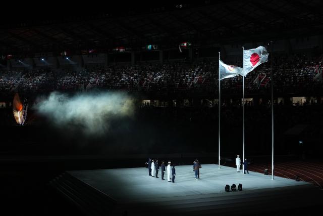 (261004) -- NAGOYA, Oct. 4, 2026 (Xinhua) -- The national flag of Japan and flag of Olympic Council of Asia (OCA) are seen during the closing ceremony of the 20th Asian Games Aichi-Nagoya 2026 in Nagoya, Japan, Oct. 4, 2026. (Xinhua/Cheong Kam Ka)