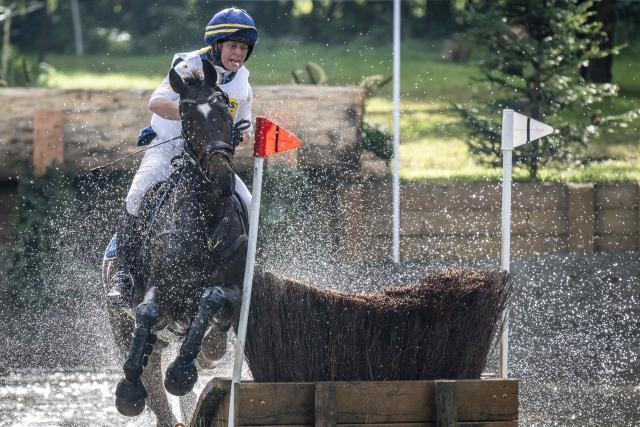 (261004) -- ENSCHEDE, Oct. 4, 2026 (Xinhua) -- A participant competes during the cross-country phase of the 55th Military Boekelo-Enschede in village Boekelo of Enschede, the Netherlands, Oct. 3, 2026. Military Boekelo-Enschede is a major international equestrian event held annually in Boekelo in the eastern Netherlands since 1971. The FEI four-star long-format eventing competition combines three disciplines: dressage, cross-country and show jumping. (Photo by Eric Brinkhorst/Xinhua)