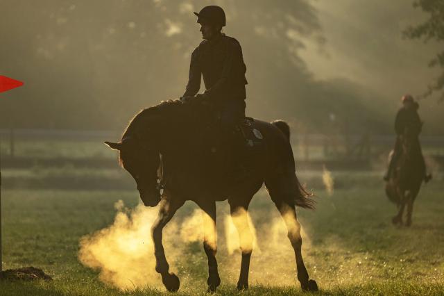(261004) -- ENSCHEDE, Oct. 4, 2026 (Xinhua) -- A participant warms up before the cross-country phase of the 55th Military Boekelo-Enschede in village Boekelo of Enschede, the Netherlands, Oct. 3, 2026. Military Boekelo-Enschede is a major international equestrian event held annually in Boekelo in the eastern Netherlands since 1971. The FEI four-star long-format eventing competition combines three disciplines: dressage, cross-country and show jumping. (Photo by Eric Brinkhorst/Xinhua)
