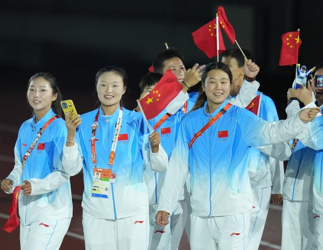 (261004) -- NAGOYA, Oct. 4, 2026 (Xinhua) -- The delegation of China parade into the stadium during the closing ceremony of the 20th Asian Games Aichi-Nagoya 2026 in Nagoya, Japan, Oct. 4, 2026. (Xinhua/Wang Fei)