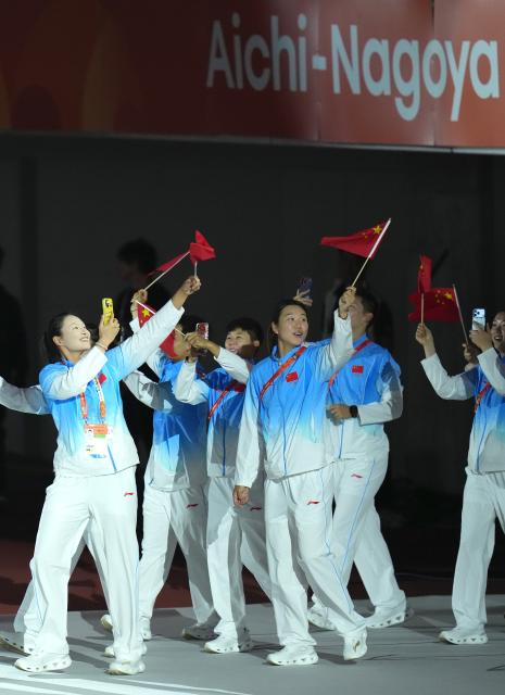 (261004) -- NAGOYA, Oct. 4, 2026 (Xinhua) -- The delegation of China parade into the stadium during the closing ceremony of the 20th Asian Games Aichi-Nagoya 2026 in Nagoya, Japan, Oct. 4, 2026. (Xinhua/Wang Fei)