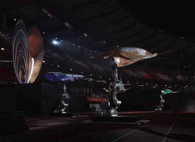 (261004) -- NAGOYA, Oct. 4, 2026 (Xinhua) -- Flags are waved by robotic arms during the closing ceremony of the 20th Asian Games Aichi-Nagoya 2026 in Nagoya, Japan, Oct. 4, 2026. (Xinhua/Jia Haocheng)