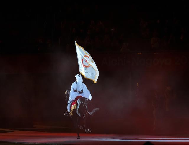(261004) -- NAGOYA, Oct. 4, 2026 (Xinhua) -- This photo taken on Oct. 4, 2026 shows the performance of Qatar, the host country of the next Asian Games, during the closing ceremony of the 20th Asian Games Aichi-Nagoya 2026 in Nagoya, Japan. (Xinhua/Chen Zeguo)