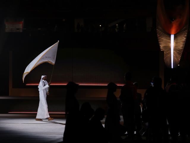 (261004) -- NAGOYA, Oct. 4, 2026 (Xinhua) -- Mutaz Essa Barshim of Qatar carries the flag of Olympic Council of Asia (OCA) during the closing ceremony of the 20th Asian Games Aichi-Nagoya 2026 in Nagoya, Japan, Oct. 4, 2026. (Xinhua/Jia Haocheng)