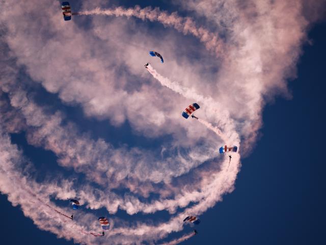 (261004) -- HUNTINGTON BEACH, Oct. 4, 2026 (Xinhua) -- Parachutists perform during the Pacific Airshow in the city of Huntington Beach, Orange County, California, the United States, Oct. 3, 2026. The Pacific Airshow, one of the largest of its kind in the United States, kicked off here on Friday. (Photo by Qiu Chen/Xinhua)
