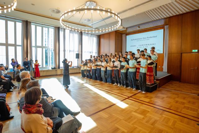 (261004) -- ESSEN, Oct. 4, 2026 (Xinhua) -- Students perform during a youth exchange concert in Essen, Germany, Oct. 3, 2026. Chinese and German students took the stage together on Saturday in the western German city of Essen for a youth exchange concert aimed at fostering cultural understanding and friendship through music.
   TO GO WITH "Chinese, German youth build ties through music at exchange concert" (Germany's Burg Chinese Chorus/Handout via Xinhua)